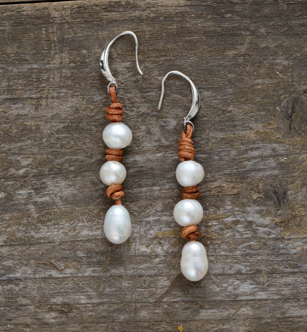 These earrings are 8mm freshwater pearls on leather. 
